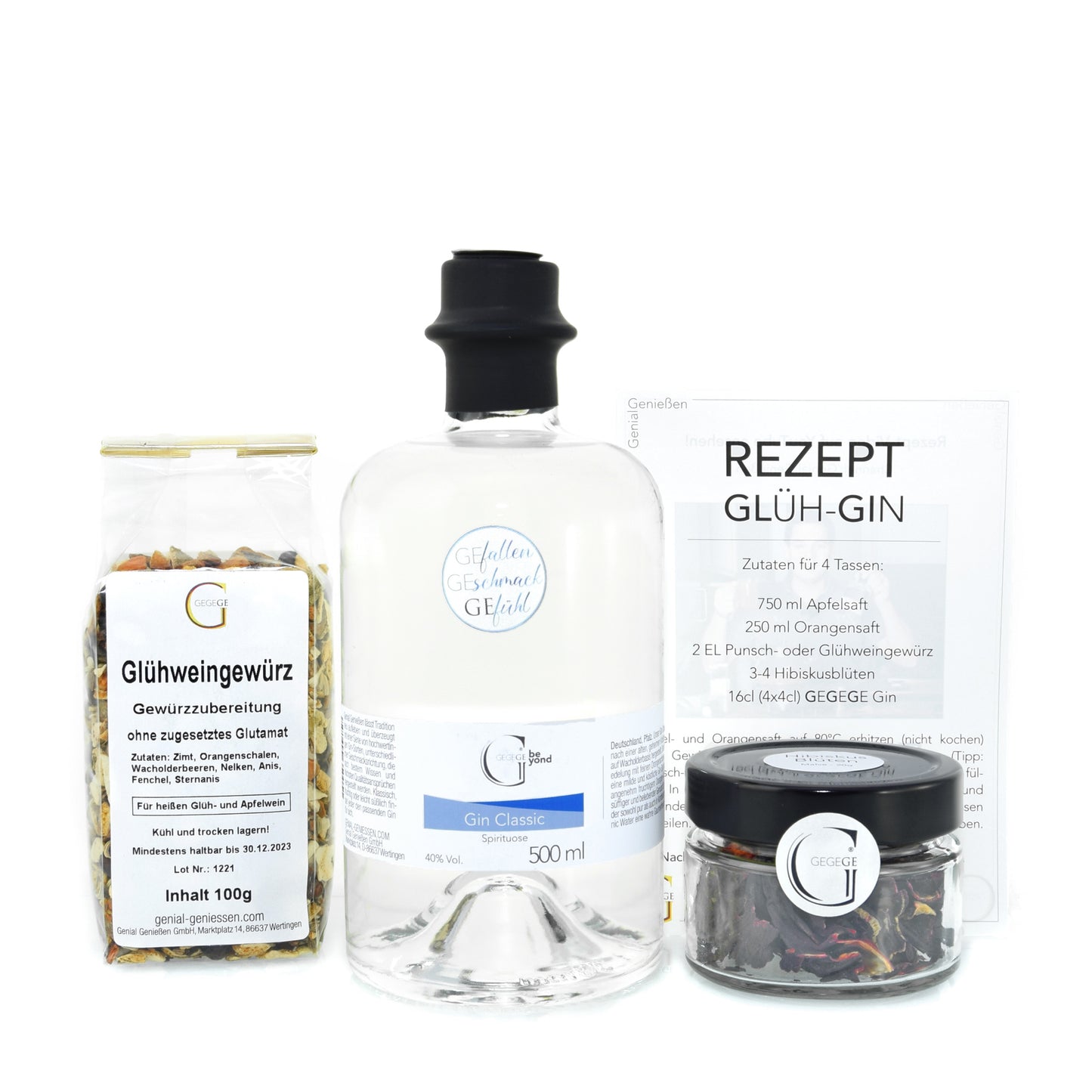 Goldenes Glüh Gin Geschenkset von Genial Genießen mit 500 ml Gin, winterlichem Glühweingewürz, Hibiskusblüten und Rezeptkarte als besondere Geschenkidee für die Advents und Weihnachtszeit.