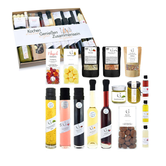 Hochwertiges Genial Genießen Geschenkset mit feinen Zutaten zum Kochen und Verfeinern von Speisen, stilvoll zusammengestellt als Geschenk für Genießer und gemeinsame Mahlzeiten.