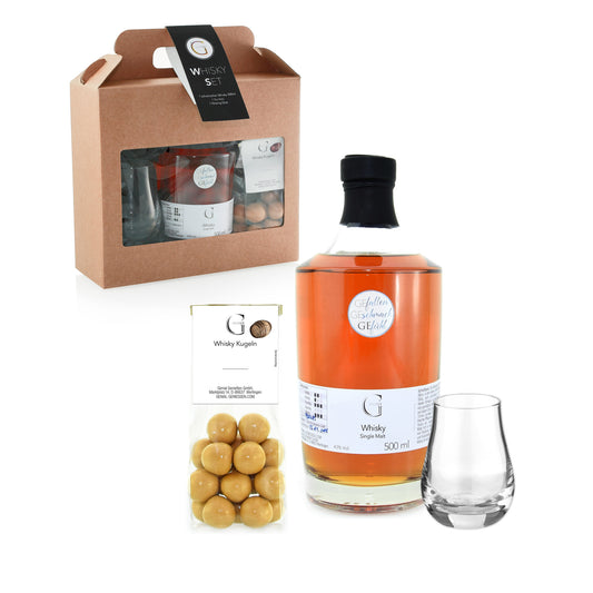 Hochwertiges Whisky Geschenkset von Genial Genießen mit schottischem Single Malt Whisky, Glas und Whisky-Steinen, stilvoll verpackt als edles Präsent für Genießer.