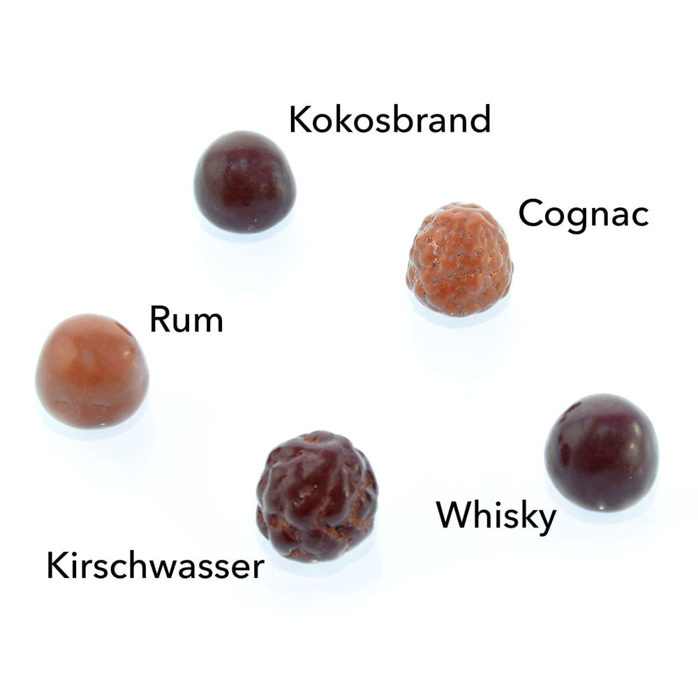 Genial Genießen Erlesene Brände mit Whisky-, Rum-, Kirschwasser-, Cognac-, Kokosfüllung. Übersicht.