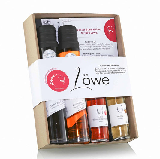 Sternzeichen Löwe Geschenkset von Genial Genießen mit ausgewählten Feinkostspezialitäten wie BBQ-Öl, Dattel-Speck-Crema, Café-de-Paris-Dip, Whisky Balsam und Weinbergpfirsich Balsam für genussvolle Momente.


