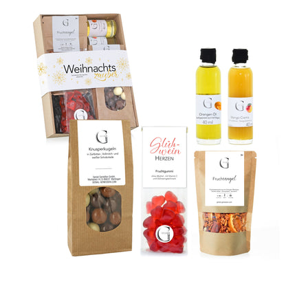 Alkoholfreies Genial Genießen Geschenkset „Weihnachtszauber“ mit feinen Delikatessen wie aromatischen Ölen, Dip-Gewürzen, Tee und weihnachtlichen Süßigkeiten.